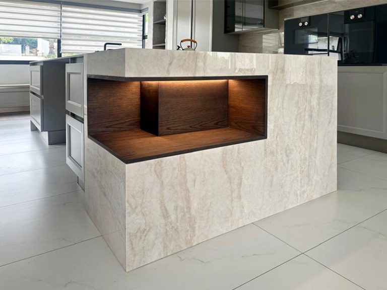 Custom stone kitchen island with wooden shelf inlay